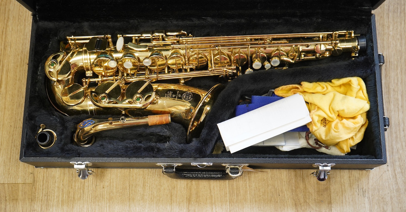 A cased Selmer 80 Super Action Series II brass alto saxophone. Condition - good